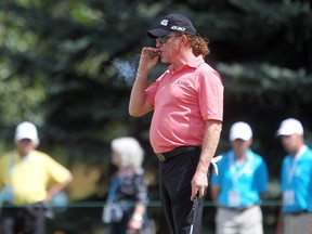 Spain's Miguel Angel Jimenez takes a puff of his cigar during Wednesday's Pro-Am round at Canyon Meadows. The 51-year-old is competing in the Shaw Charity Classic for the first time, using the tourney as a warm-up for next week's PGA Championship.