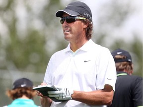 Calgary's Stephen Ames  checks his yardage during Wednesday's Shaw Charity Classic Pro-Am round.