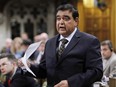 Conservative MP and Parliamentary Secretary to the Minister of Foreign Affairs and for International Human Rights Deepak Obhrai stands in the House of Commons during question period Friday May 30, 2014.