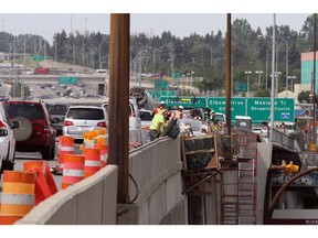 Construction crews on the Glenmore overpass over Centre Street, in Calgary.