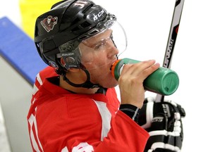 Beck Malenstyn, seen during a water break at Calgary Hitmen training camp on Monday, has been training hard all summer in preparation for a big season in the WHL, his NHL draft campaign.