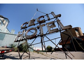 CALGARY.;  AUGUST 14, 2015 -- Crews take down the Cecil Hotel sign in Calgary on August 14, 2015.  Photo Leah Hennel/Calgary Herald (For City story by ?)