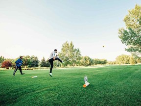 A competitor "tees off" at the HeatherGlen footgolf course.