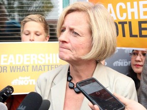 Premier Rachel Notley speaks to reporters Tuesday following a campaign rally ahead of the Sept. 3 byelection in Calgary-Foothills.