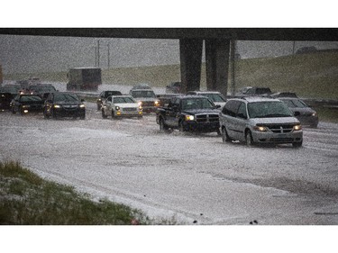 Deerfoot Trail is iced over by hail during the rush hour commute in Calgary on Tuesday, Aug. 4, 2015.