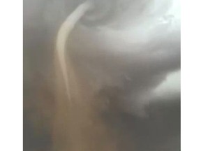 A video screen grab from Steven and Andrew Hougen's video of a tornado near Foremost, Alberta, on Thursday, Aug. 6, 2015.