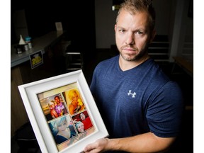 Matt Mounteer, co-owner of Fortified Fitness, holds a photo collage that was created by staffer Annette Milbers in memory of Kamber Lindenbach, on Tuesday, Aug. 4, 2015. Lindenbach, a personal trainer at the gym, died Sunday.