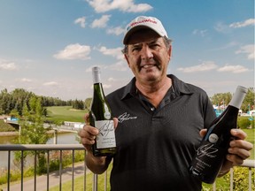 Champions Tour golfer David Frost shows off 2013 and 2014 vintage wines at the Canyon Meadows Golf and Country Club in Calgary on Tuesday. He's playing in the Shaw Charity Classic.