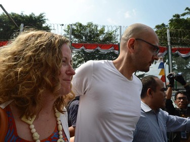 Freed Canadian school administrator Neil Bantleman (R) walks with his wife Tracy Bantleman (L) outside Jakarta's Cipinang prison on August 14, 2015 following his release from jail. Bantleman, who also holds British nationality, and Indonesian teaching assistant Ferdinand Tjiong were jailed for 10 years each in April and ordered to pay a hefty fine.