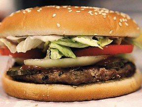 WARNING: CMYK IMAGE. DO NOT USE FOR NORMAL OUTPUT OR WEB. ONLY FOR USE FOR NATIONAL POST CLOSECROP IN PRINT  //NPCLOSECROP// Local Input~ A whopper burger sits in the kitchen at a Burger King restaurant in Basildon, U.K., on Wednesday, Sept. 8, 2010. Burger King Holdings Inc. agreed to be acquired by 3G Capital, a New York investment firm backed by Brazilian investors, for $3.3 billion in the biggest restaurant acquisition in at least a decade. Photographer: Chris Ratcliffe/Bloomberg ORG XMIT: 1038883266 ORG XMIT: POS1412041507461178