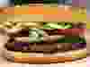 WARNING: CMYK IMAGE. DO NOT USE FOR NORMAL OUTPUT OR WEB. ONLY FOR USE FOR NATIONAL POST CLOSECROP IN PRINT  //NPCLOSECROP// Local Input~ A whopper burger sits in the kitchen at a Burger King restaurant in Basildon, U.K., on Wednesday, Sept. 8, 2010. Burger King Holdings Inc. agreed to be acquired by 3G Capital, a New York investment firm backed by Brazilian investors, for $3.3 billion in the biggest restaurant acquisition in at least a decade. Photographer: Chris Ratcliffe/Bloomberg ORG XMIT: 1038883266 ORG XMIT: POS1412041507461178