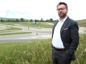 James Robertson, president and chief executive of the West Campus Development Trust, at the site of the proposed mixed-use University District project.