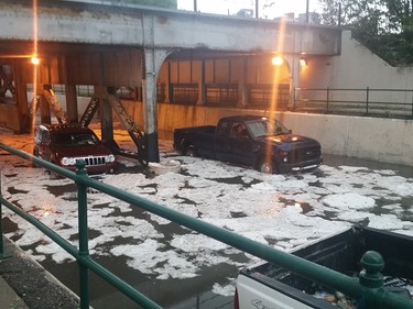 Jose Kreft captured this image of the underpass of Macleod Trail North between 11th and 10th Ave SE heading into downtown. The passengers are still in the vehicles with hail surrounding them.