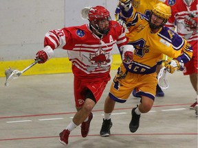 Okotoks Raiders transition Leighton Gibson, left, edges around Coquitlam Adanacs runner Mike Rybka to take the ball out of Raiders territory at the Max Bell Centre in Calgary in game 2 of the Western Canadian junior lacrosse final series on Friday.
