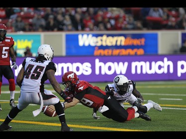 Stampeders Quarterback Bo Levi Mitchell takes the ball in for a touchdown during the first half as the Calgary Stampeders take on the Ottawa RedBlacks at McMahon Stadium in Calgary on August 15th, 2015.