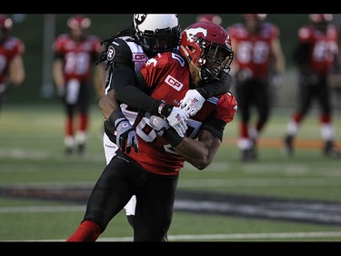 Stampeders wide receiver Eric Rogers is tackled during the first half as the Calgary Stampeders take on the Ottawa RedBlacks at McMahon Stadium in Calgary on August 15th, 2015.