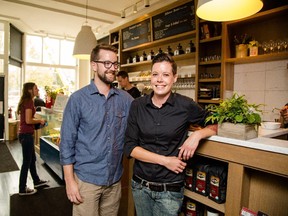 Erik Burley, left, and Kristi McLeod take time to show off a newly renovated Vendome Cafe in Calgary