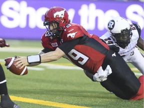 Calgary Stampeders' quarterback Bo Levi Mitchell dives for one of his two rushing touchdowns in Saturday's win over the Ottawa Redblacks.