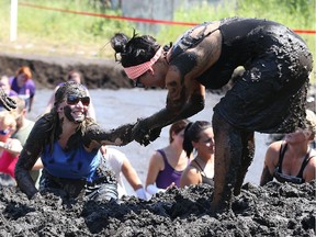 Participants tackle the Mud Hero Winnipeg course at Hill Top Resort near Grand Beach on Sat., July 25, 2015.