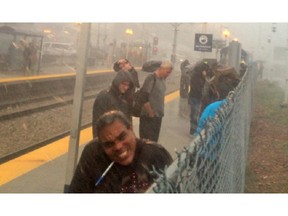Transit passengers were pelted with hail followed by heavy rains after being told to get off the train at the 39th Street station during Tuesday's thunderstorm in spite of a lack of shelter.
