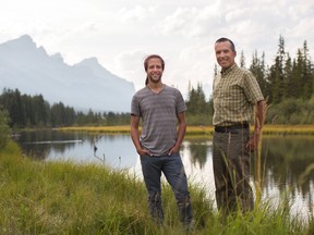 Kevin Van TIghem (right) and his son, Brian, collaborated on a book about the Bow River called Heart Waters.