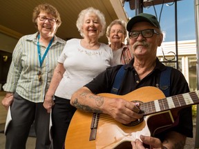 Sheila Hansen, left, Ruby Friesen, Gladys Grabinsky, and Lawrence Potapoff pose at the Silvera for Senior Residents in Calgary on Tuesday, Aug. 11, 2015.