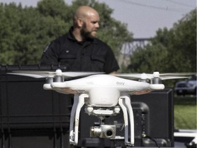 Lethbridge Regional Police Service Constable Jonathan Blackwood demonstrates the use of an Unmanned Aerial Vehicles (UAVs) Thursday August 13, 2015. The force has added 3 of the drones to it's fleet.