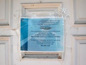 A provincial government sign on the door of a Riverdale Avenue home  that is one of the flood affected houses on the street slated for demolition.