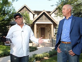 Alberta Party leader Greg Clark, right, talks with Riverdale resident Terry Fishman in front of the home slated to be torn down next to his house on Thursday August 13, 2015. Clark held a media briefing on Riverdale Avenue to highlight what he says is the NDP government adding insult to injury to Conservative policies by quietly planning to tear down 49 properties purchased under the Floodway Relocation program.