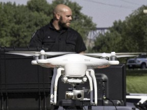 Lethbridge Regional Police Service Const. Jonathan Blackwood demonstrates the use of an Unmanned Aerial Vehicles (UAVs) on Thursday August 13, 2015. The force has added three of the drones to its fleet.