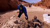 Matt buries Nick up to his neck in sand during a challenge on The Amazing Race Canada.