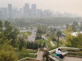 Calgary's downtown shrouded in smoke from fires in Washington, as seen from the McHugh Bluff on Tuesday, August 25.