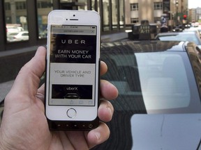 The ride-sharing app Uber is shown on a smartphone in Montreal, Thursday, May 14, 2015.