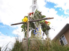 A growing memorial for Farida Abdurahman sits where the pedestrian was killed while in a Calgary crosswalk July 28. Reader who lost her son-in-law to a driver in a crosswalk wants all motorists to consider others' safety.