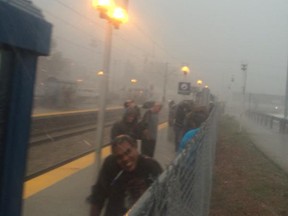 Andy Tylo shot this picture of Calgary commuters stranded at a train station during a hail storm on Tuesday, August 4.