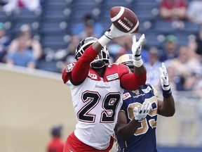 Calgary Stampeders defensive back Jamar Wall knocks down a pass intended for Winnipeg Blue Bombers' Clarence Denmark during the first half on Saturday. He later had a pick-six.