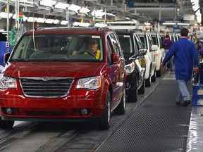hrysler Canada workers drive vehicles off the Final Car line at Windsor Assembly Plant.
