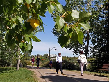Calgarians enjoy the beautiful weather along the Glenmore Reservoir in Calgary on September 1, 2015.