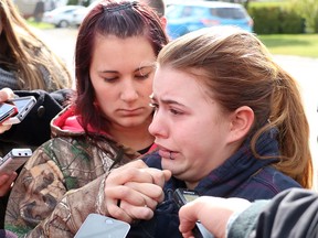 Cheyenne Dunbar, mother of Hailey Dunbar-Blanchette, centre, was supported by friends as she spoke about her daughter after formal first-degree murder charges were laid against Derek Saretzky on Sept. 16, 2015.