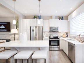 The kitchen in the Inspire show home by Innovations by Jayman in Evanston.