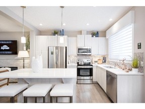 The kitchen in the Inspire show home by Innovations by Jayman in Evanston.