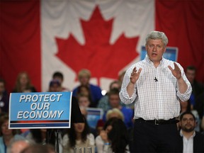 Prime Minister Stephen Harper speaks with Conservative Party supporters at a campaign rally during a stop in Calgary, on Sept. 15, 2015.