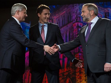 Prime Minister Stephen Harper, left, Liberal Leader Justin Trudeau, centre, and New Democratic Leader Tom Mulcair, greet and shake hands before the Globe and Mail Leader's Debate 2015 in Calgary, on September 17, 2015.