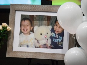 A photograph of brothers Alan and Ghalib Kurdi is displayed during a memorial service for them and their mother in Vancouver, B.C.