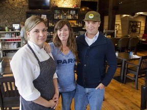 Park Distillery owners Katie Tuff and Mike Mendelman are joined by executive chef Liz Gagnon, left, in one of the dining areas at the new Banff Avenue restaurant in Banff