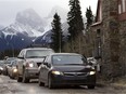 Vehicles enter Banff National Park at the east park gates.