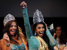 Mrs. Canada Ashley Burnham (centre) celebrates after being crowned Mrs. Universe during the 2015 pageant final in Minsk, Belarus on Aug. 29.