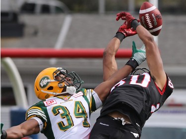 Wide Receiver Eric Rogers misses this pass along with Eskimo Ryan King during first half Labour Day Classic action at McMahon Stadium on Monday September 7, 2015.