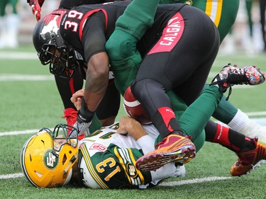 Charleston Hughes sacks Eskimos quarterback Mike Reilly during second half Labour Day Classic action at McMahon Stadium on Monday September 7, 2015. Calgary won the game 16-7.