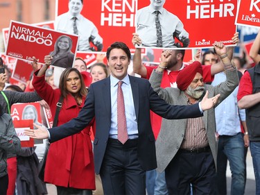 Liberal Leader Justin Trudeau arrives with a band of supporters at the BMO Centre in Calgary Thursday night.